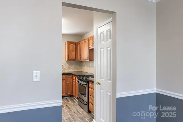 a view of a kitchen from the hallway