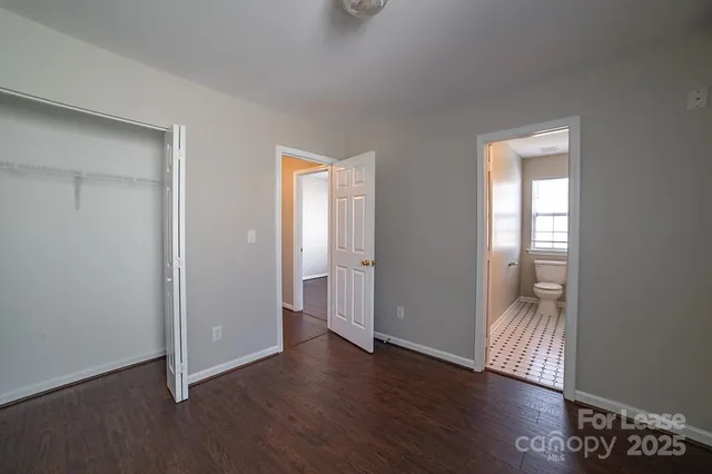 a bathroom with a sink a toilet and a window