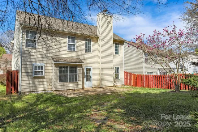 a view of a park with large trees