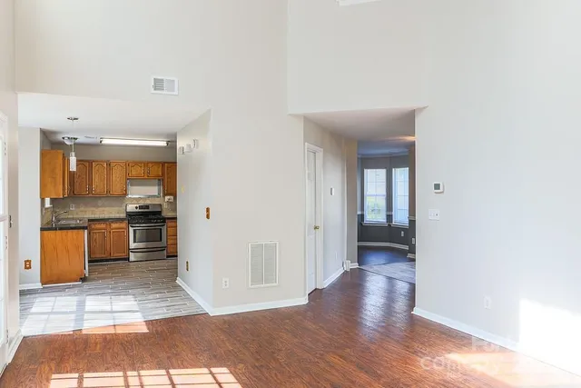 a view of a kitchen with a sink and a stove