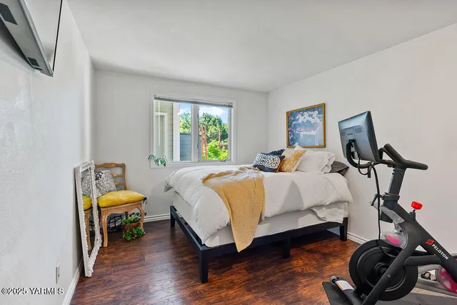 a bedroom with bed and a window