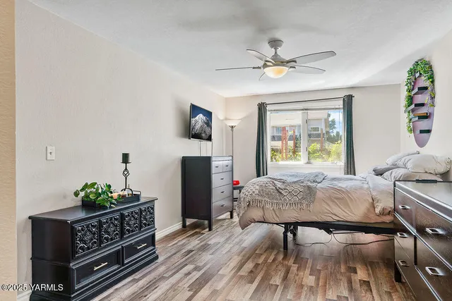 a bedroom with furniture and a window