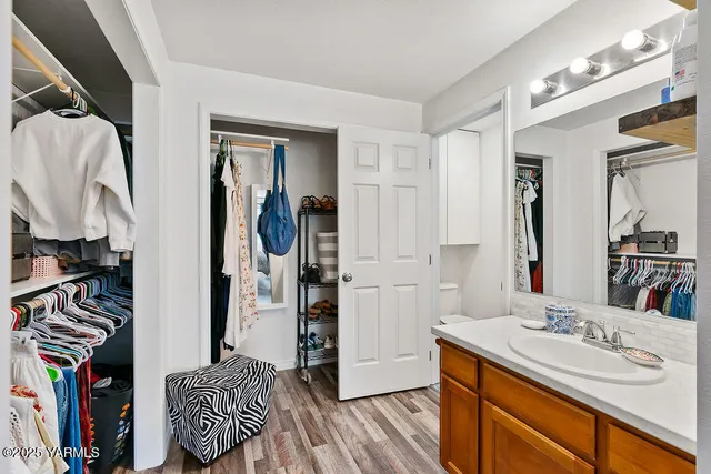 a bathroom with a sink double vanity and a mirror