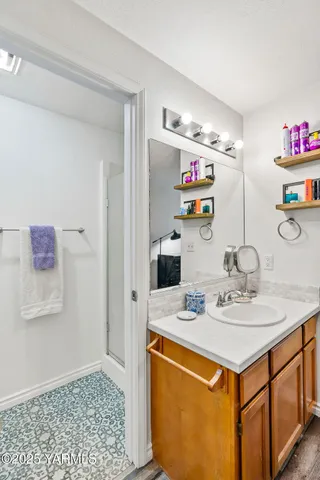 a view of kitchen island with stainless steel appliances kitchen island granite countertop a sink and cabinets