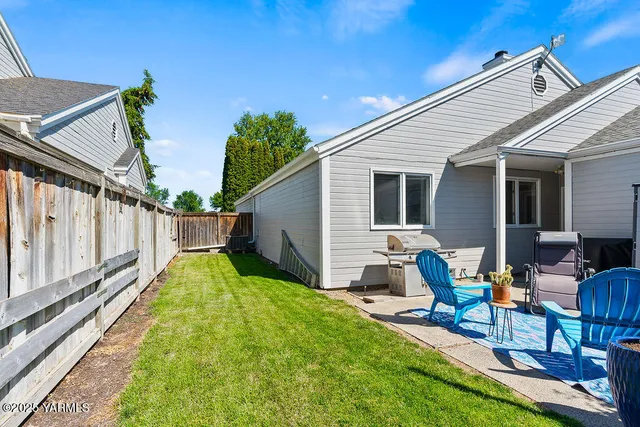 a backyard of a house with seating space