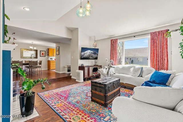 a living room with furniture or couch and a bookshelf