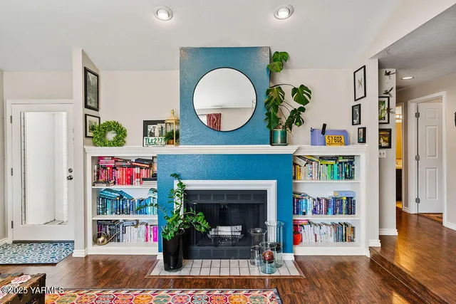 a living room with furniture and a fireplace