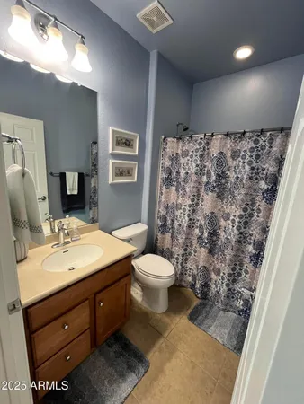 a kitchen with stainless steel appliances granite countertop a refrigerator sink and cabinets