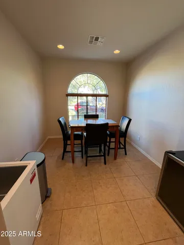 a view of a livingroom with furniture and a window