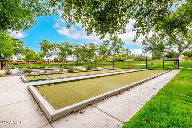 a view of a lake with lawn chairs