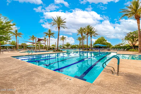 a view of a swimming pool with a patio