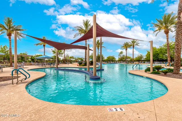 a view of a table and chairs under an umbrella