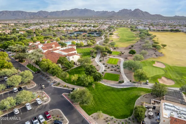an aerial view of residential houses with outdoor space and river
