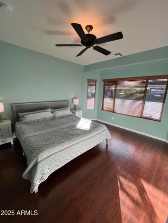 a bedroom with a bed and window