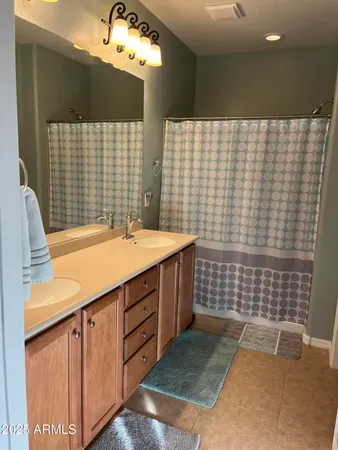 a bathroom with a sink a vanity and a mirror