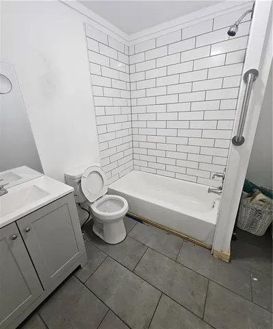 a bathroom with a sink a toilet and bathtub