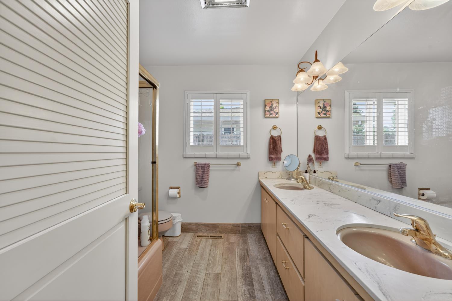 1880 Magnolia Street Gridley, CA 95948 - Photo 29 of 95 a bathroom with a sink a large mirror and a shower