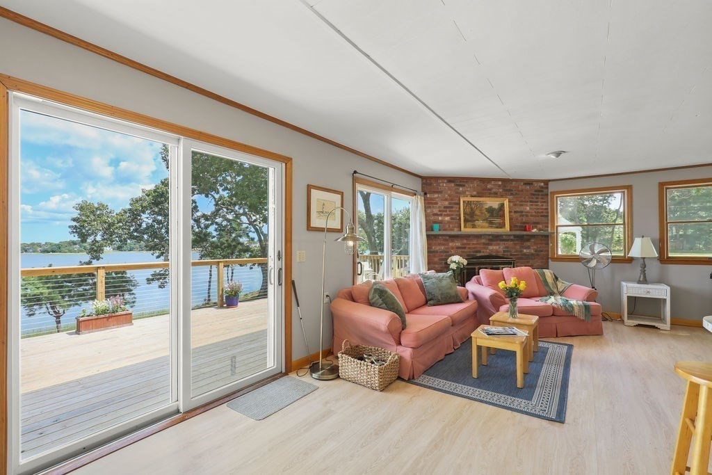14 Salt Marsh Lane Wareham, MA 02571 - Photo 11 of 42 a living room with furniture and a floor to ceiling window