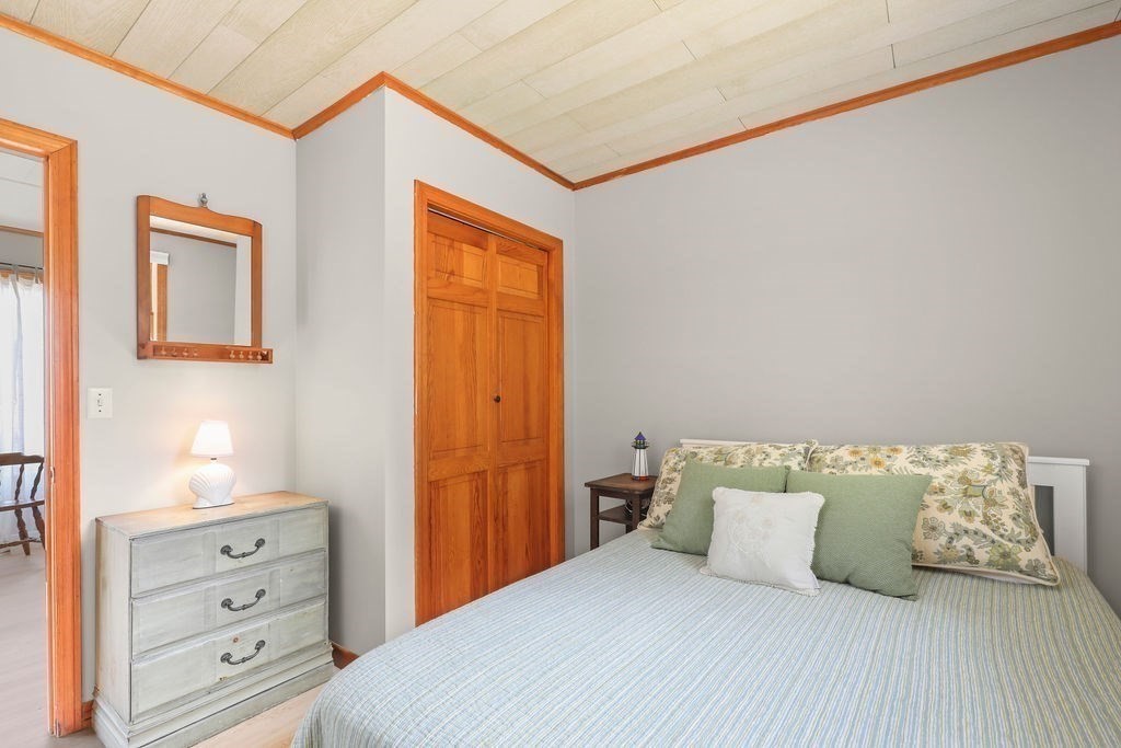 14 Salt Marsh Lane Wareham, MA 02571 - Photo 17 of 42 a bedroom with a bed and a dresser