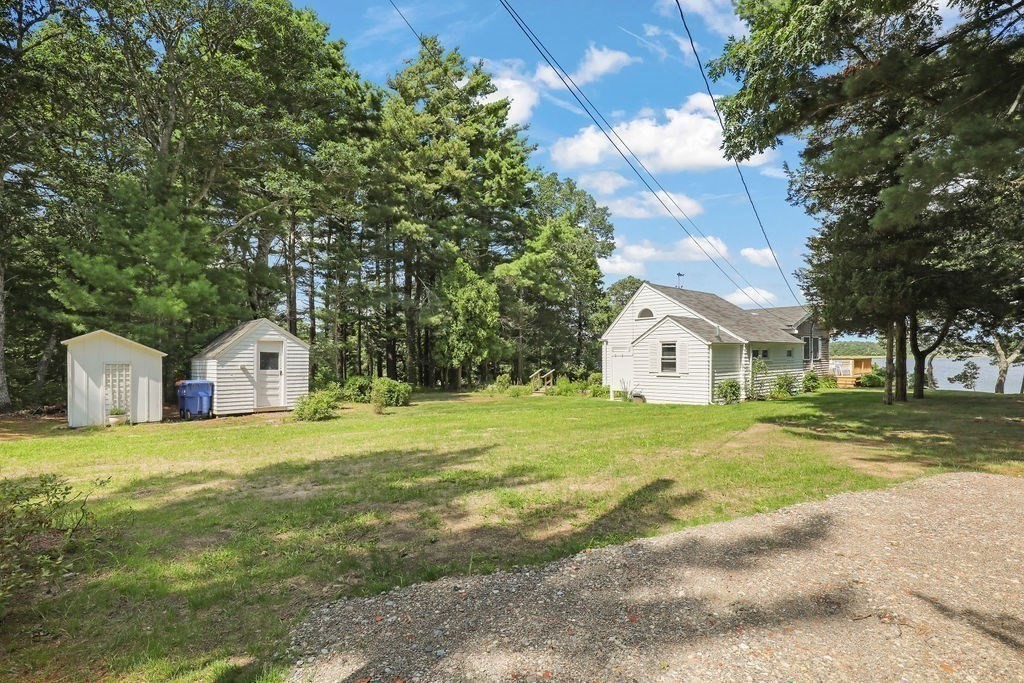 14 Salt Marsh Lane Wareham, MA 02571 - Photo 22 of 42 a large house with a big yard and large trees
