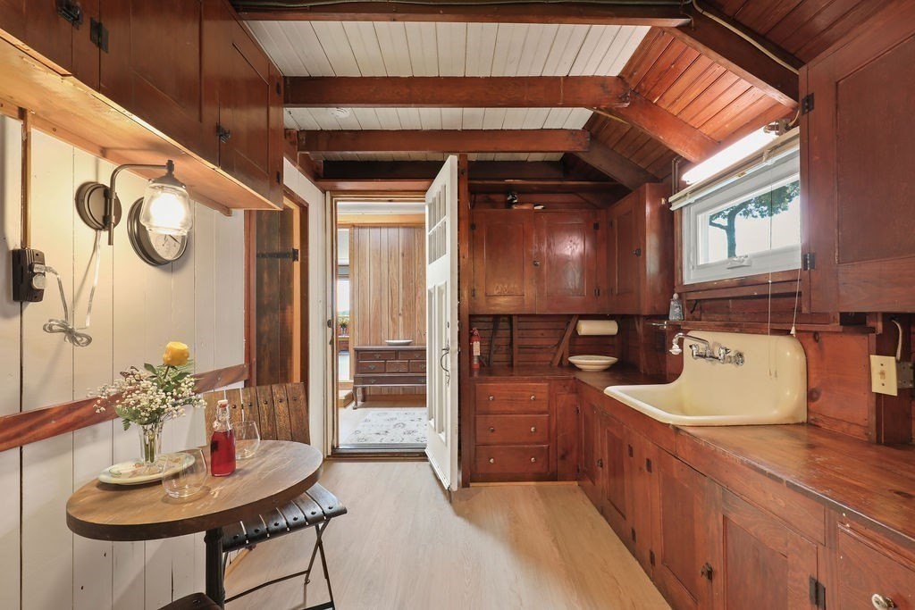 14 Salt Marsh Lane Wareham, MA 02571 - Photo 24 of 42 a kitchen with a refrigerator and a table