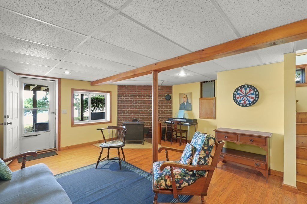 14 Salt Marsh Lane Wareham, MA 02571 - Photo 32 of 42 a living room with furniture and a table