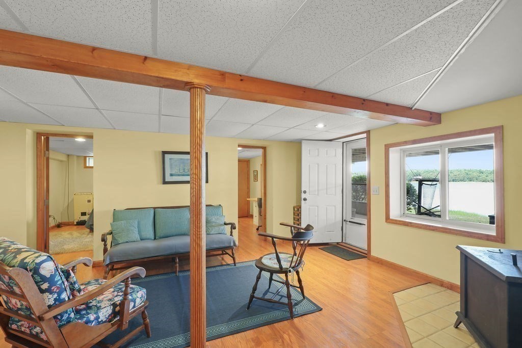 14 Salt Marsh Lane Wareham, MA 02571 - Photo 33 of 42 a living room with furniture and a table