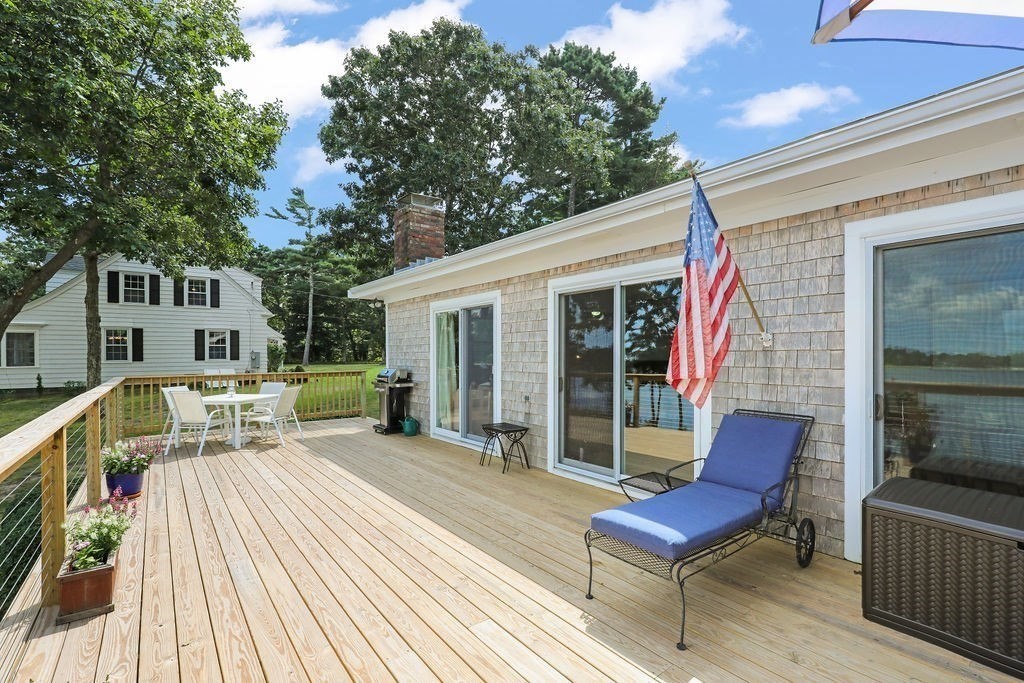 14 Salt Marsh Lane Wareham, MA 02571 - Photo 5 of 42 a view of a chair and tables in the balcony
