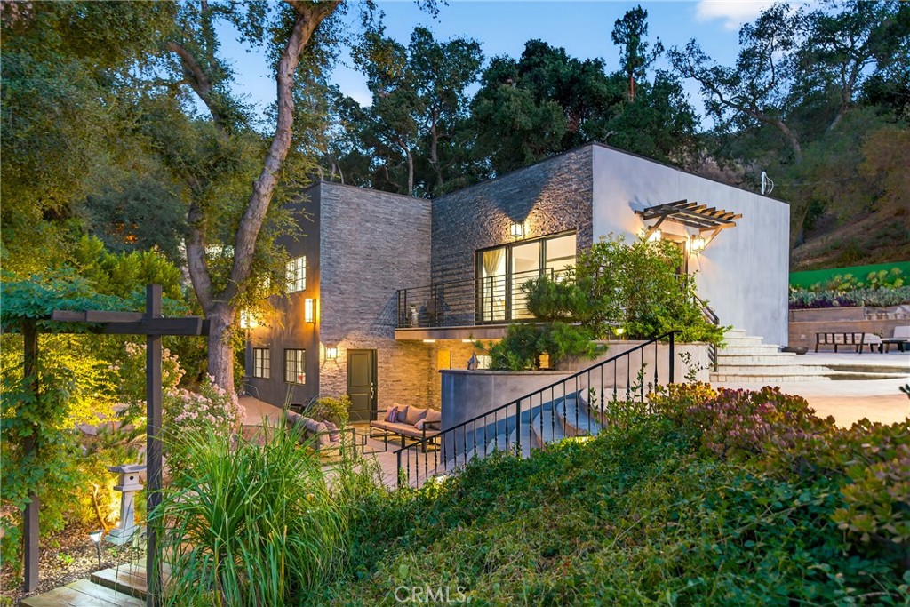7580 McGroarty Terrace Los Angeles, CA 91042 - Photo 2 of 47 a view of a house with backyard and sitting area