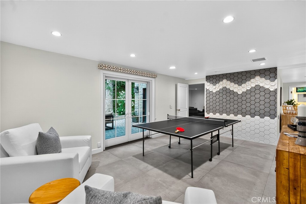 7580 McGroarty Terrace Los Angeles, CA 91042 - Photo 21 of 47 a living room with furniture a rug and a floor to ceiling window