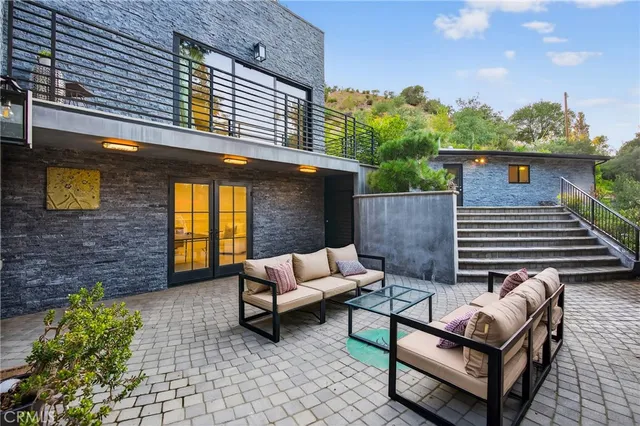 a view of a patio with a table and chairs