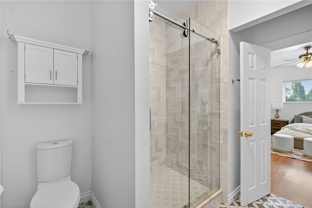 7580 McGroarty Terrace Los Angeles, CA 91042 - Photo 29 of 47 a bathroom with a toilet and a shower