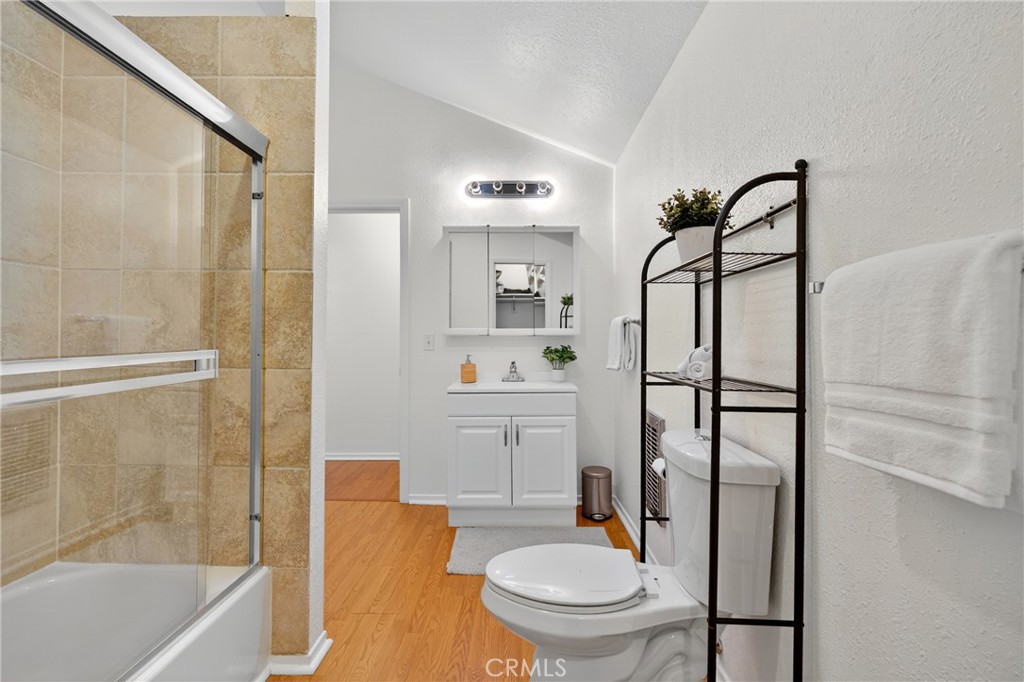 7580 McGroarty Terrace Los Angeles, CA 91042 - Photo 30 of 47 a bathroom with a granite countertop toilet sink and shower
