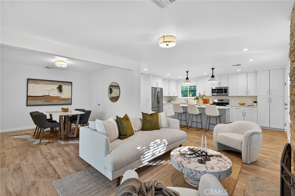 7580 McGroarty Terrace Los Angeles, CA 91042 - Photo 32 of 47 a living room with lots of furniture and kitchen view