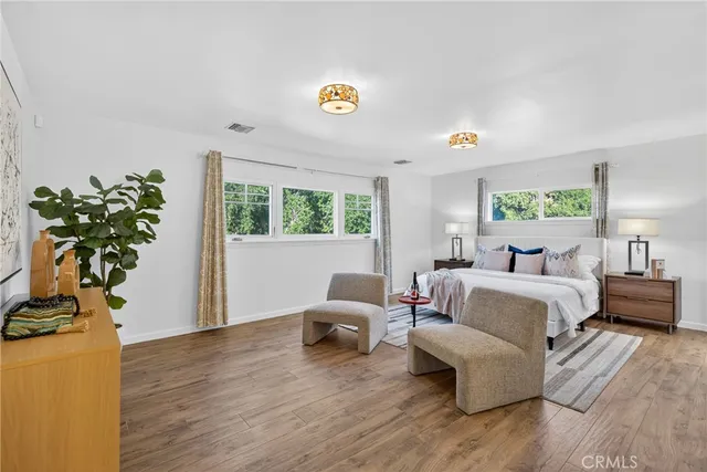 a bedroom with a bed and a couch