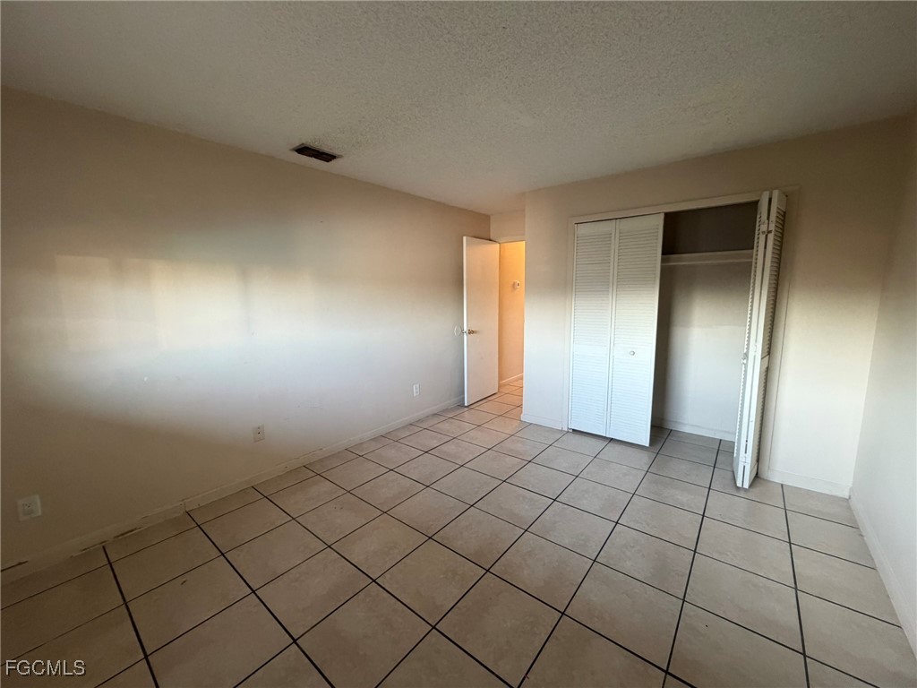 817 Gleason Parkway, Unit 3 Cape Coral, FL 33914 - Photo 5 of 12 a view of empty room