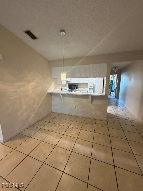 817 Gleason Parkway, Unit 3 Cape Coral, FL 33914 - Photo 10 of 12 a kitchen with stainless steel appliances a sink and cabinets