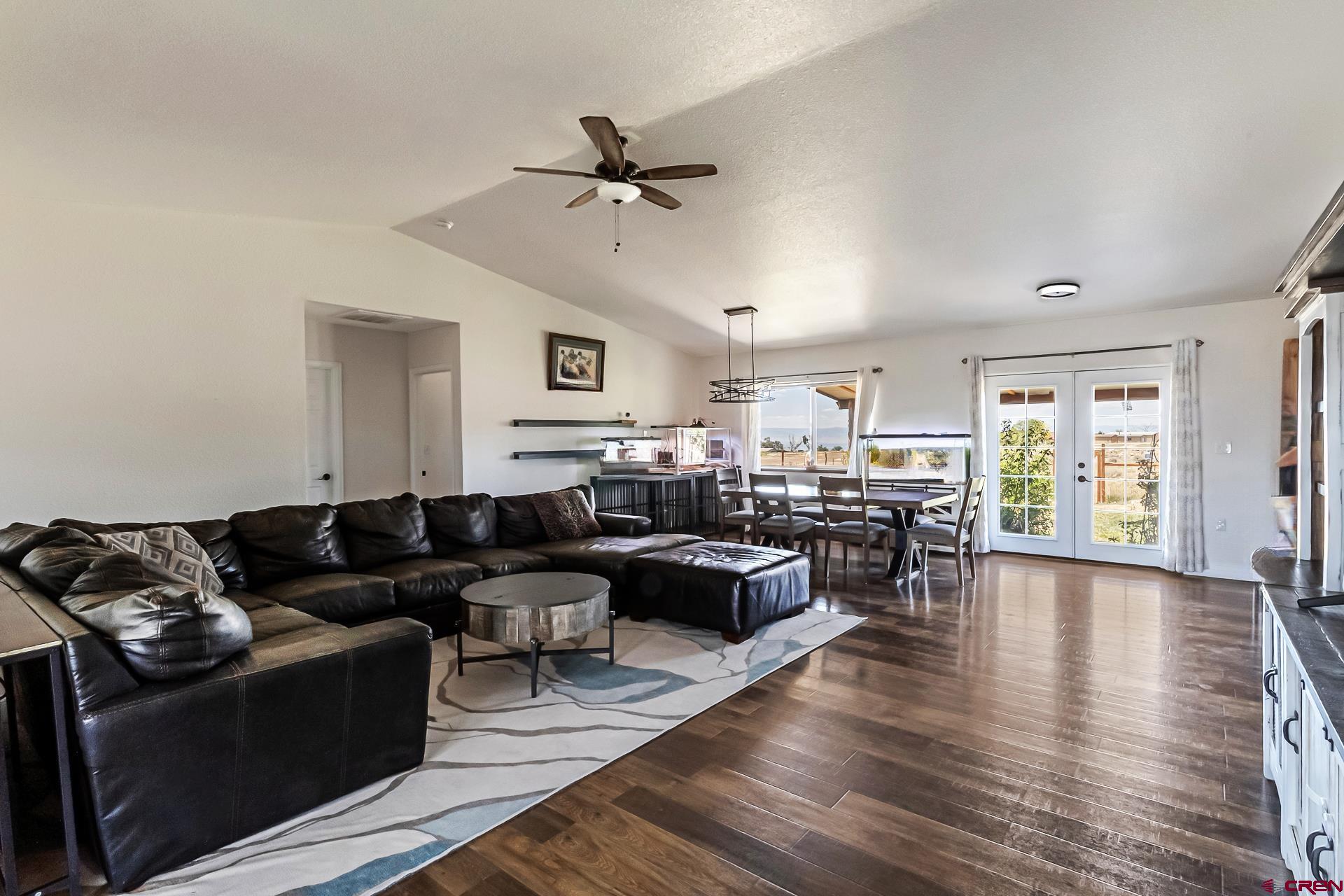 15969 Stardust Lane Cedaredge, CO 81413 - Photo 11 of 44 a living room with furniture or couch and a wooden floor