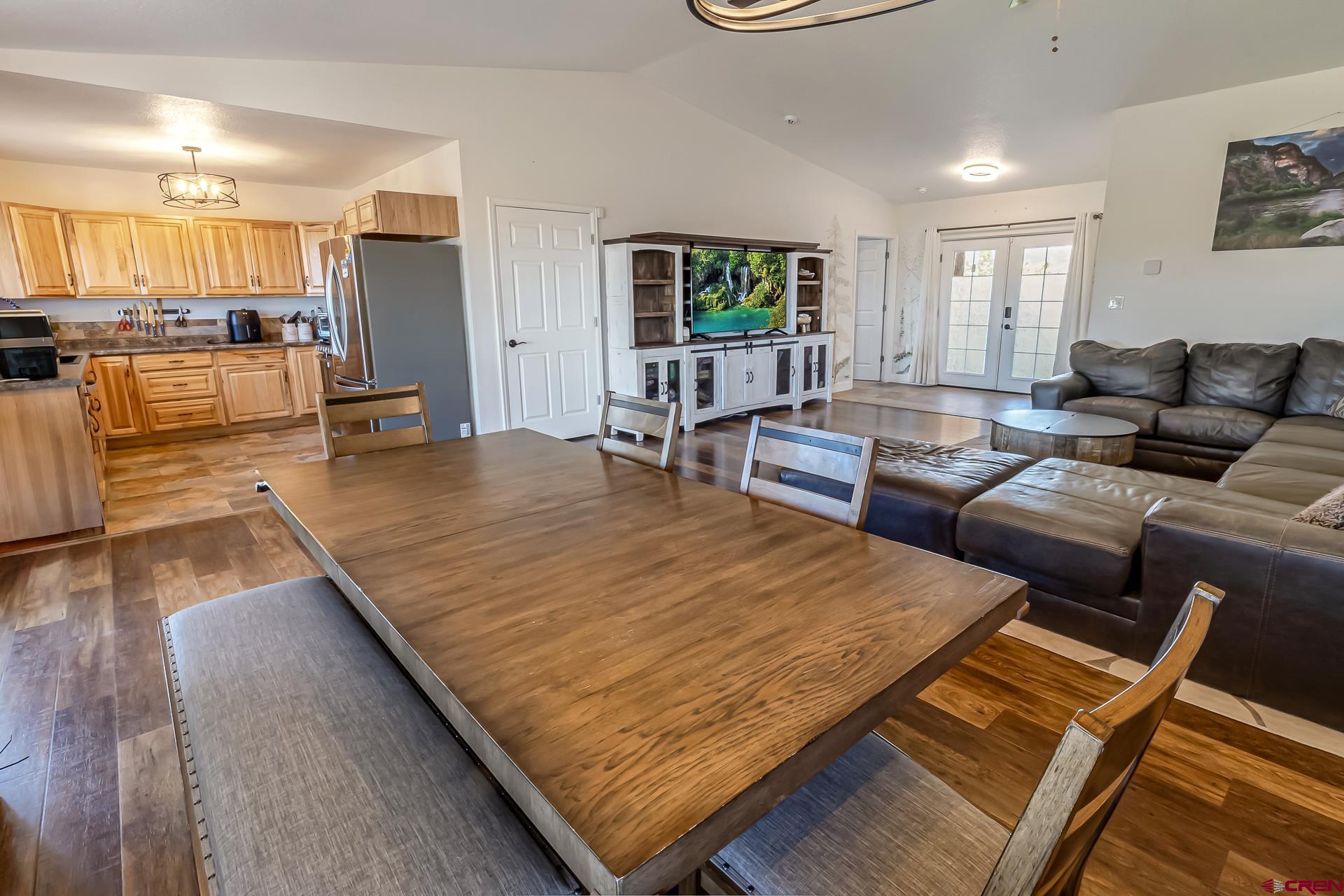 15969 Stardust Lane Cedaredge, CO 81413 - Photo 13 of 44 a living room with lots of furniture and kitchen view