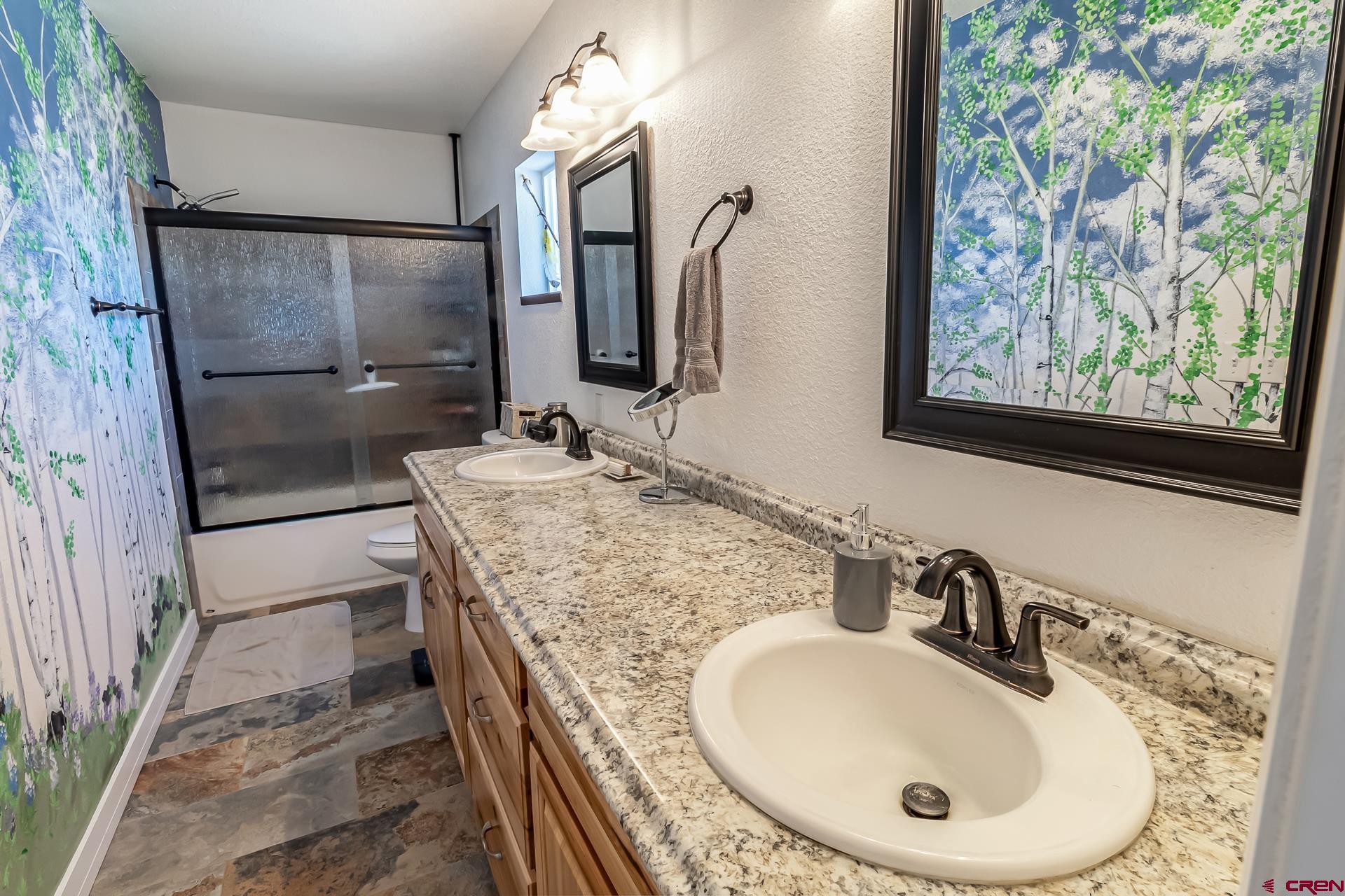 15969 Stardust Lane Cedaredge, CO 81413 - Photo 22 of 44 a bathroom with a sink and a mirror