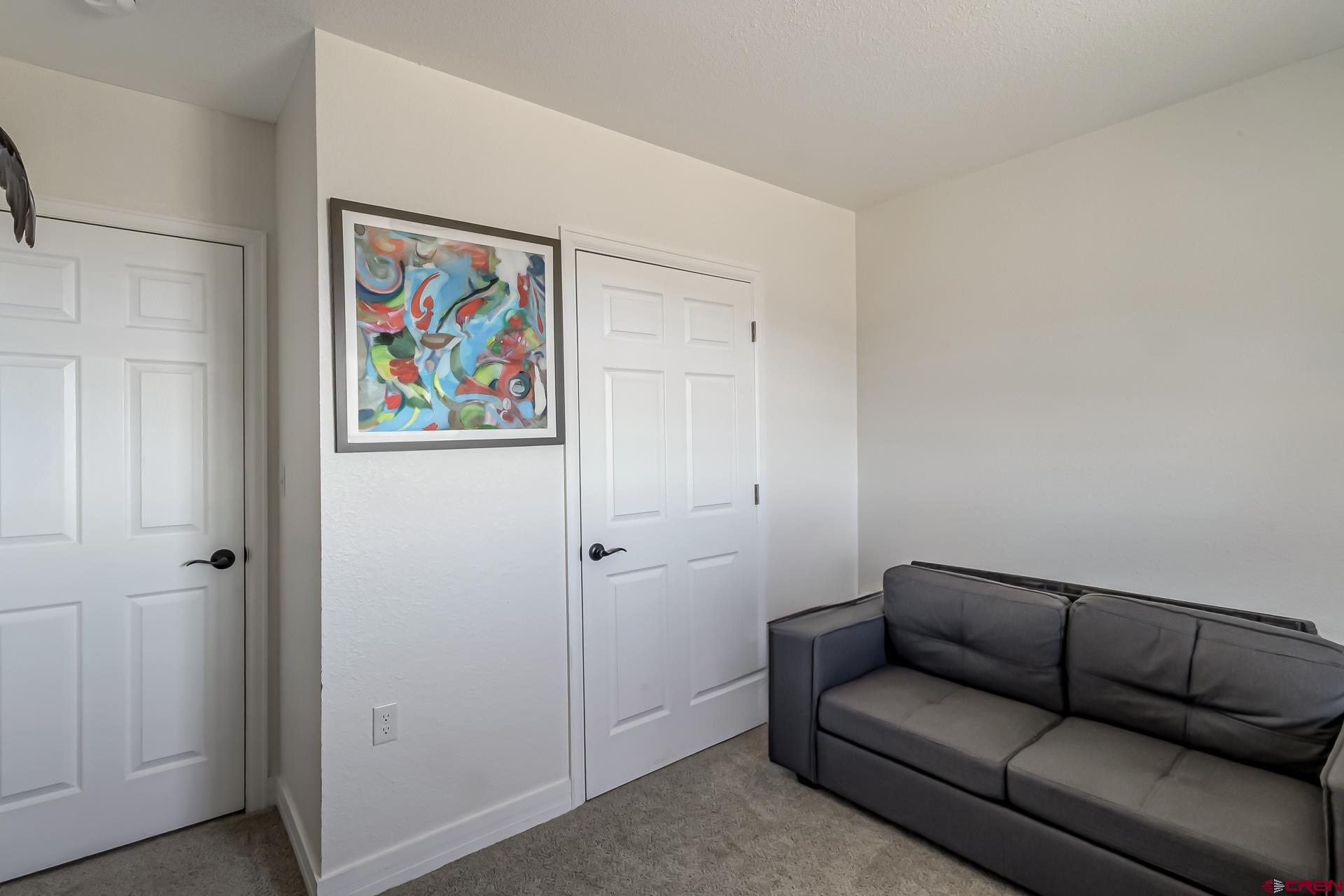 15969 Stardust Lane Cedaredge, CO 81413 - Photo 28 of 44 a living room with furniture and a air conditioner vent