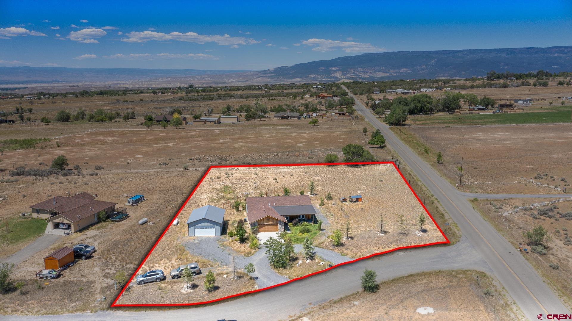 15969 Stardust Lane Cedaredge, CO 81413 - Photo 3 of 44 an aerial view of a swimming pool with an outdoor seating