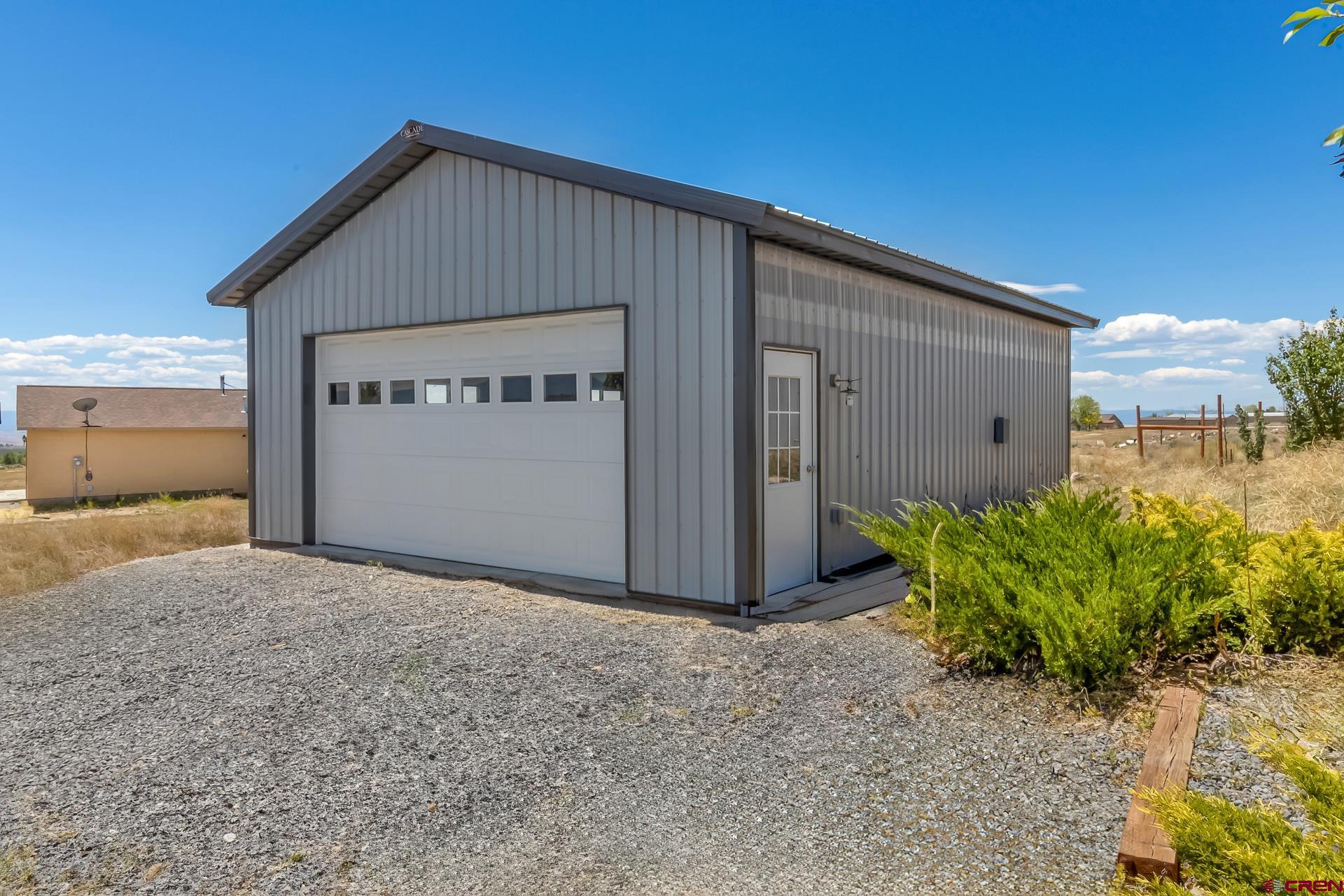 15969 Stardust Lane Cedaredge, CO 81413 - Photo 43 of 44 a view of a house with a small yard