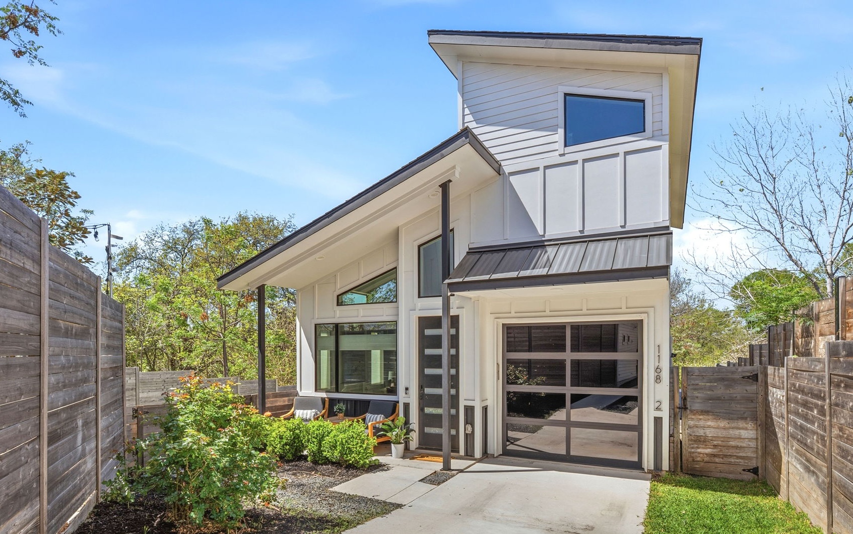 a front view of a house with a garage