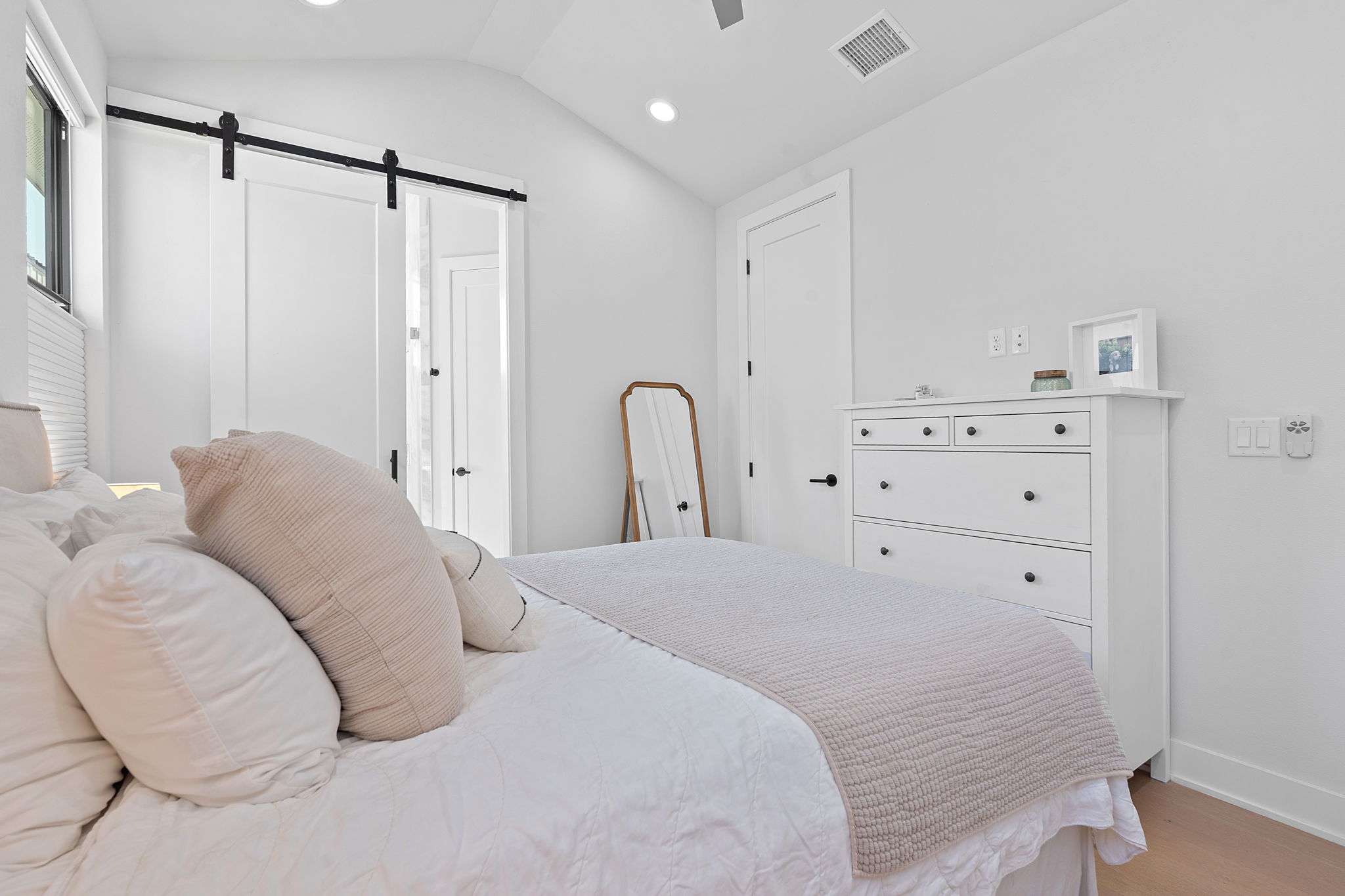 1168 Ridgeway Drive, Unit 2 Austin, TX 78702 - Photo 12 of 26 a bedroom with a bed and a dresser