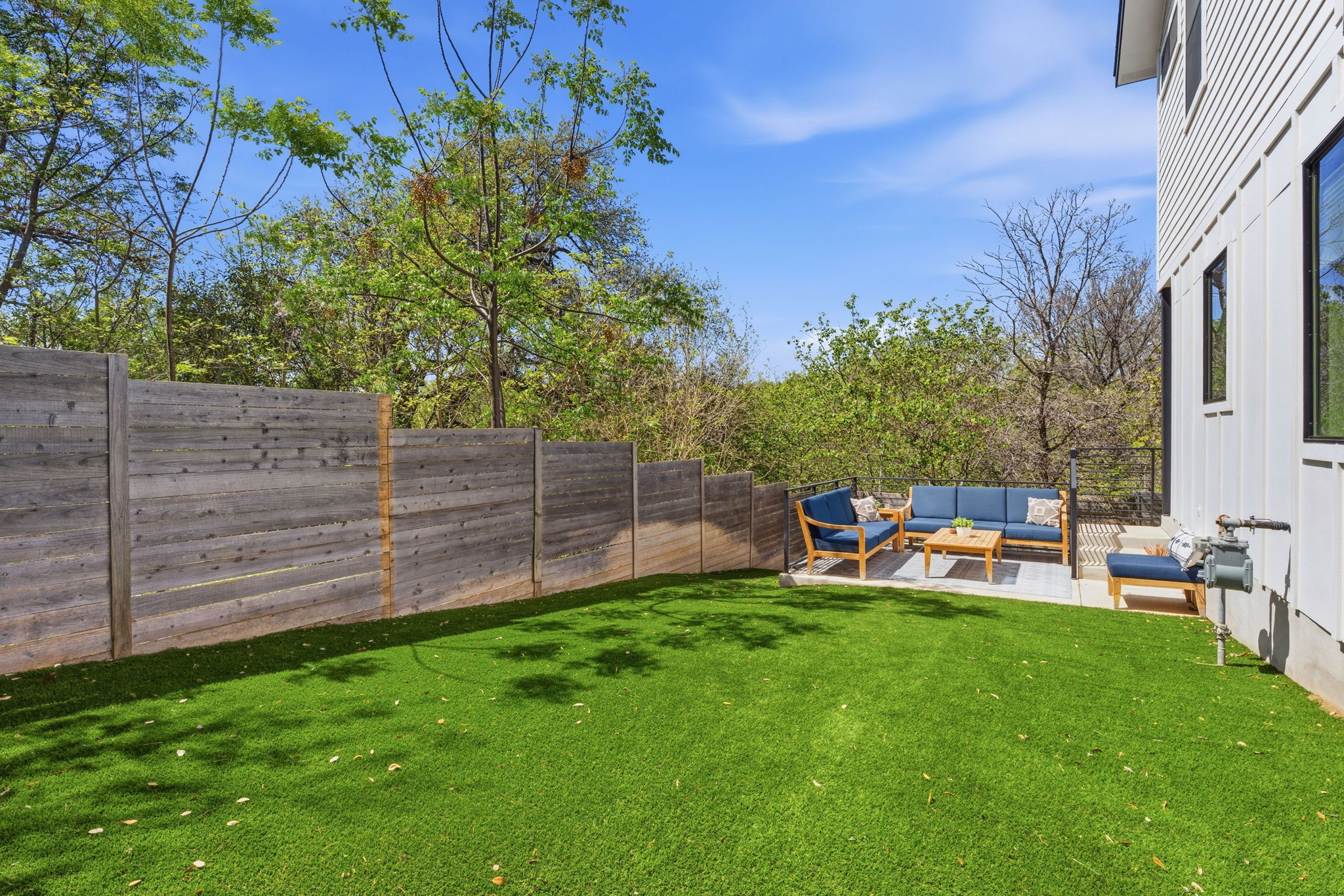 1168 Ridgeway Drive, Unit 2 Austin, TX 78702 - Photo 20 of 26 a view of a chair and table in the garden
