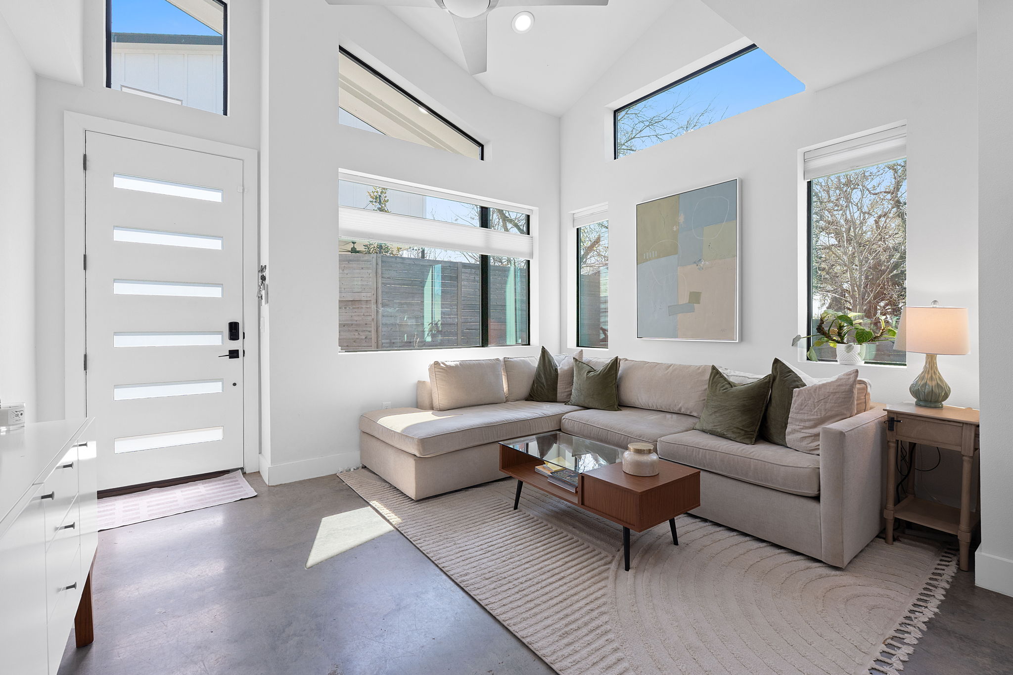 1168 Ridgeway Drive, Unit 2 Austin, TX 78702 - Photo 2 of 26 a living room with furniture and a large window