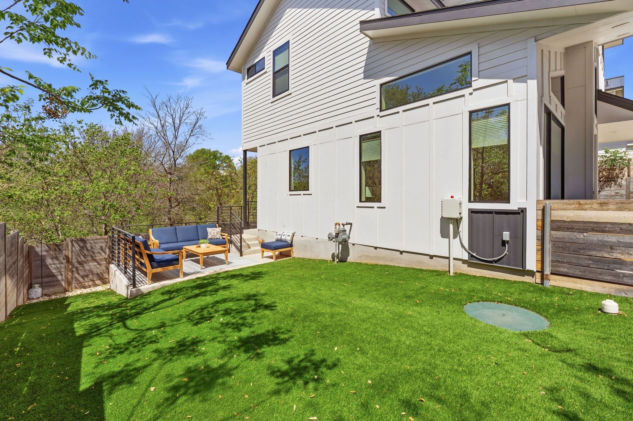 1168 Ridgeway Drive, Unit 2 Austin, TX 78702 - Photo 21 of 26 a view of a chair and table in backyard of the house