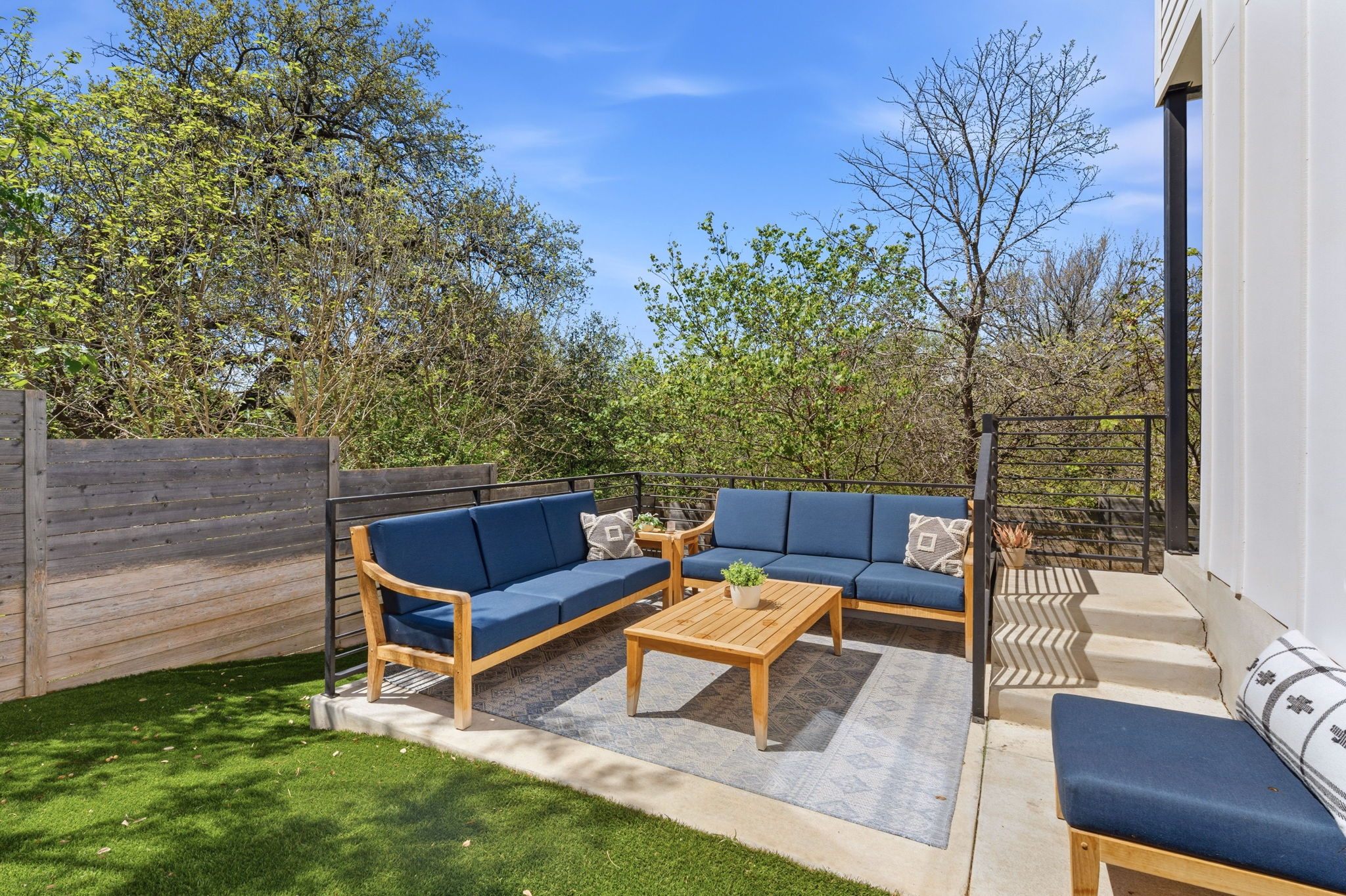1168 Ridgeway Drive, Unit 2 Austin, TX 78702 - Photo 24 of 26 a view of a backyard with couches chairs and a fire pit