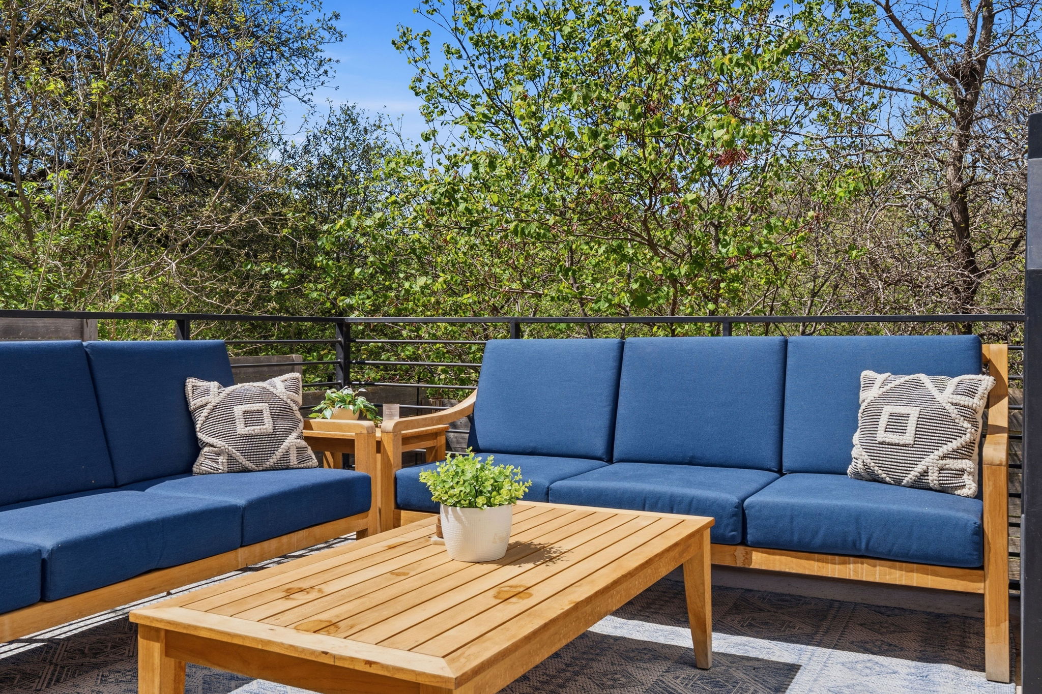 1168 Ridgeway Drive, Unit 2 Austin, TX 78702 - Photo 25 of 26 a outdoor sitting area with furniture and wooden floor